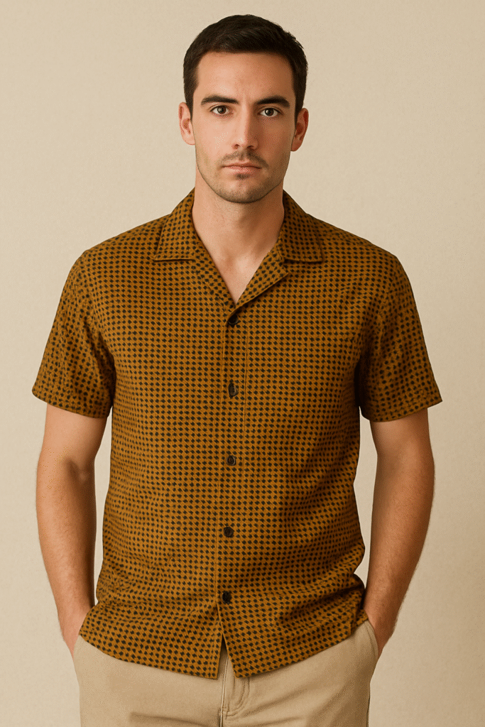 Man wearing a mini geometric print ochre and black camp collar shirt from the June 2025 Men's Style Files Desert Noir Edit
